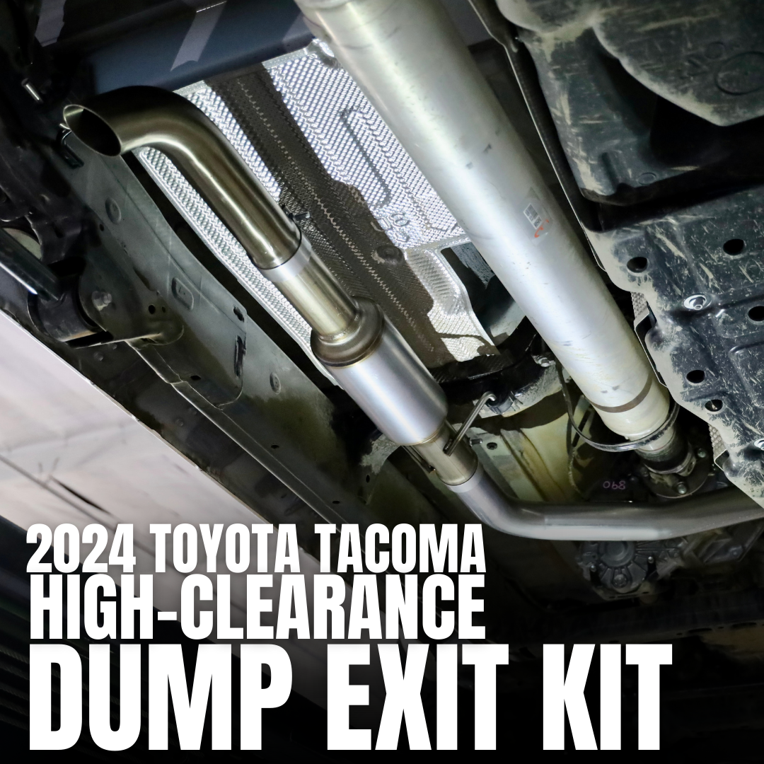 An installed 2024-2025 Toyota Tacoma Carven Exhaust Max Clearance Dump Exit Kit with text that reads "2024 Toyota Tacoma High-Clearance Dump Exit Kit"