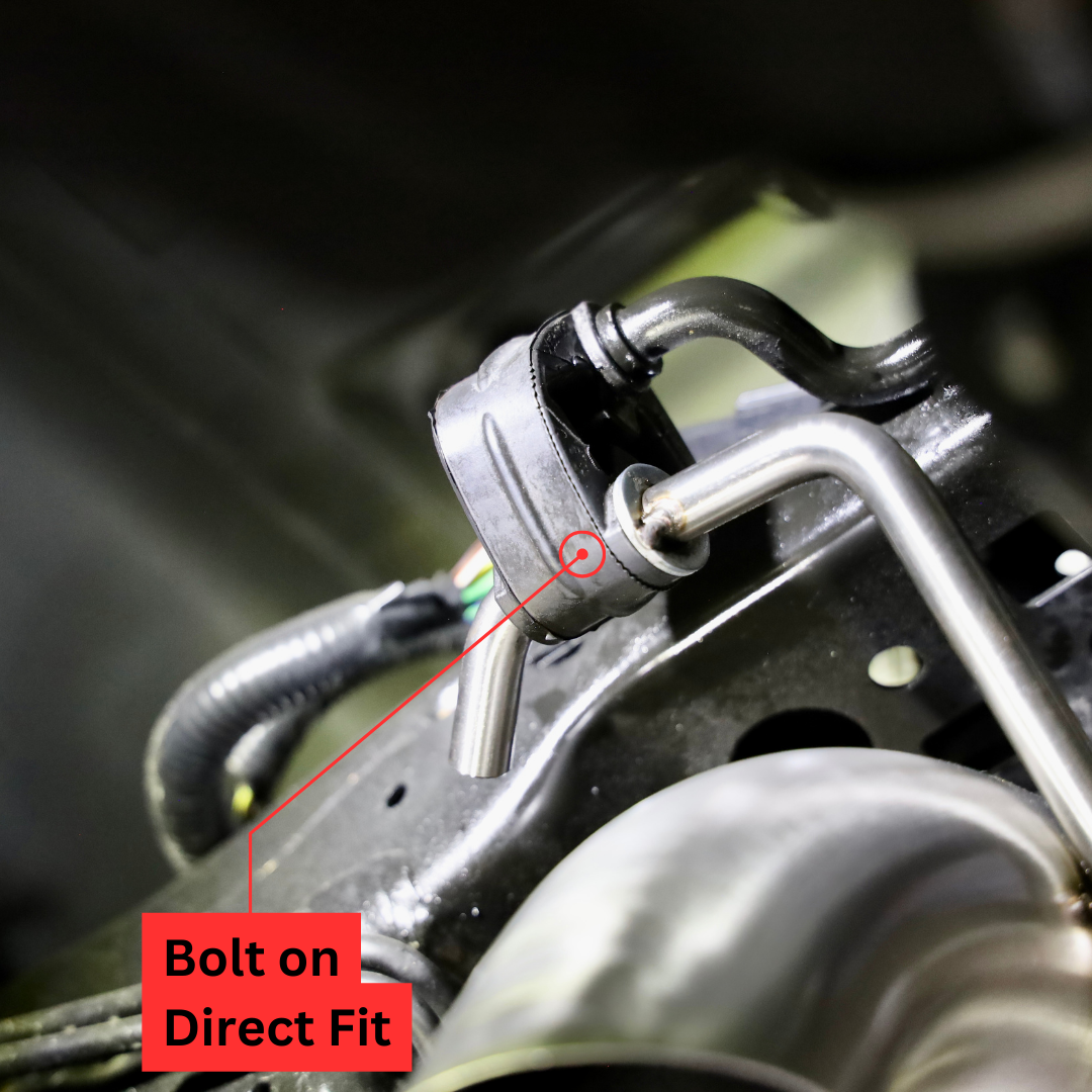 A close up of an installed 2021-2025 Ford Bronco 2.7L Carven Exhaust Dump Exit Kit on the underside of a vehicle, with text that says "Bolt on Direct Fit"
