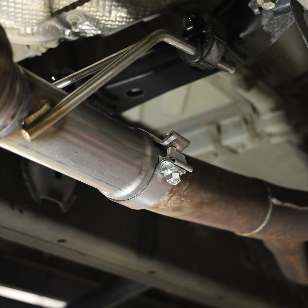 A close up of the bolts on the installed 2022-2025 Toyota Tundra Carven Exhaust Signature Clamp Back Kit