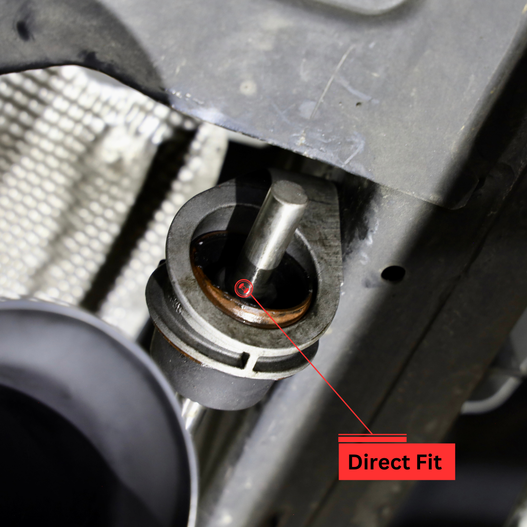 A close up of where the 2019-2023 Ford Ranger Over Axle Carven Exhaust Dump Kit installs on the underside of a vehicle with text that says "Direct Fit"