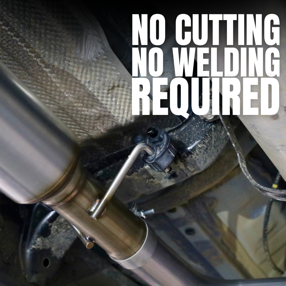 A close up of an installed 2024-2025 Toyota Tacoma Carven Exhaust Max Clearance Dump Exit Kit and text that reads "No Cutting, no welding required"