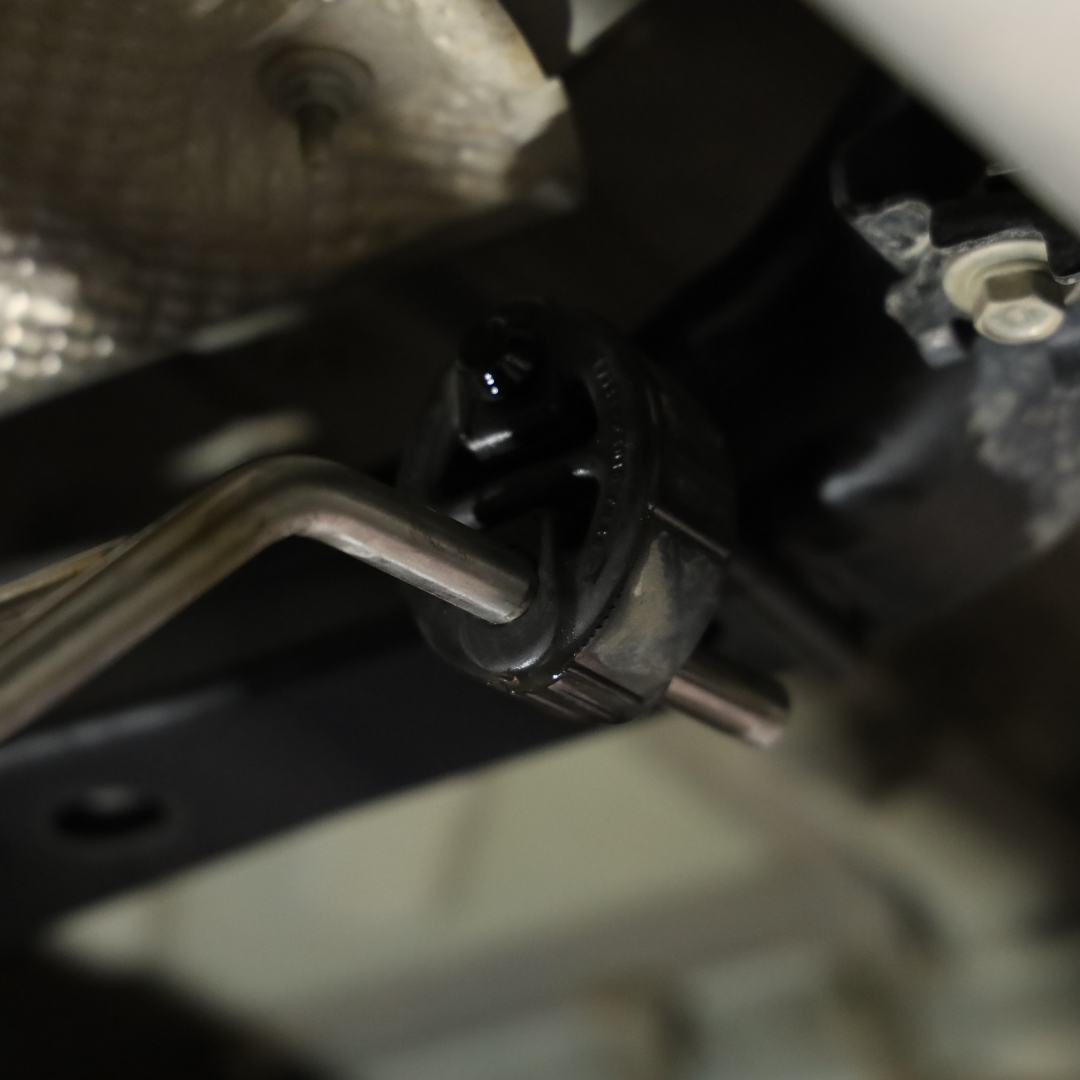 Detail shot of an installed 2022-2025 Toyota Tundra Carven Exhaust Signature Clamp Back Kit