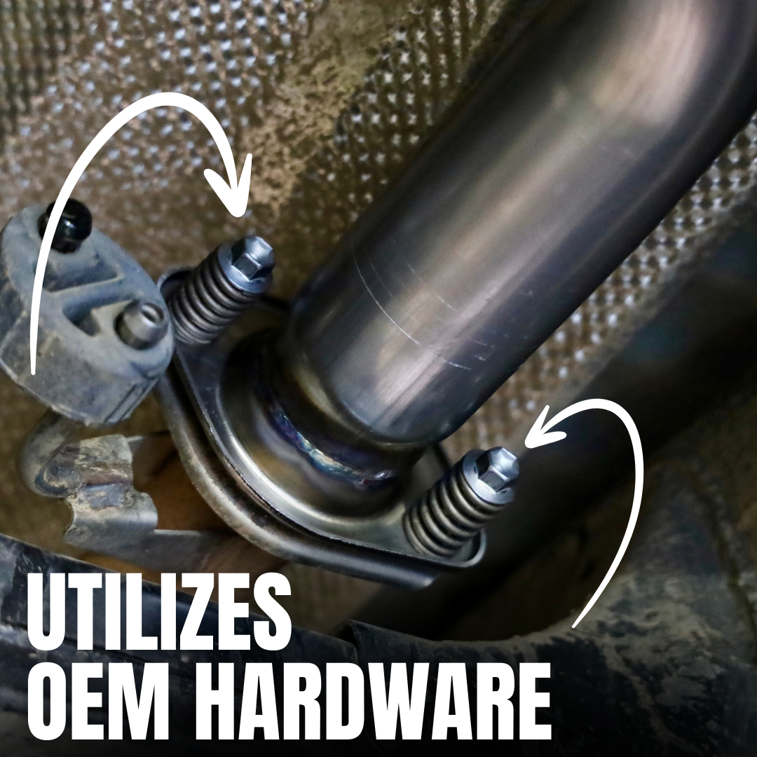 A close up of an installed 2024-2025 Toyota Tacoma Carven Exhaust Max Clearance Dump Exit Kit and text that reads "Utilizes OEM Hardware"