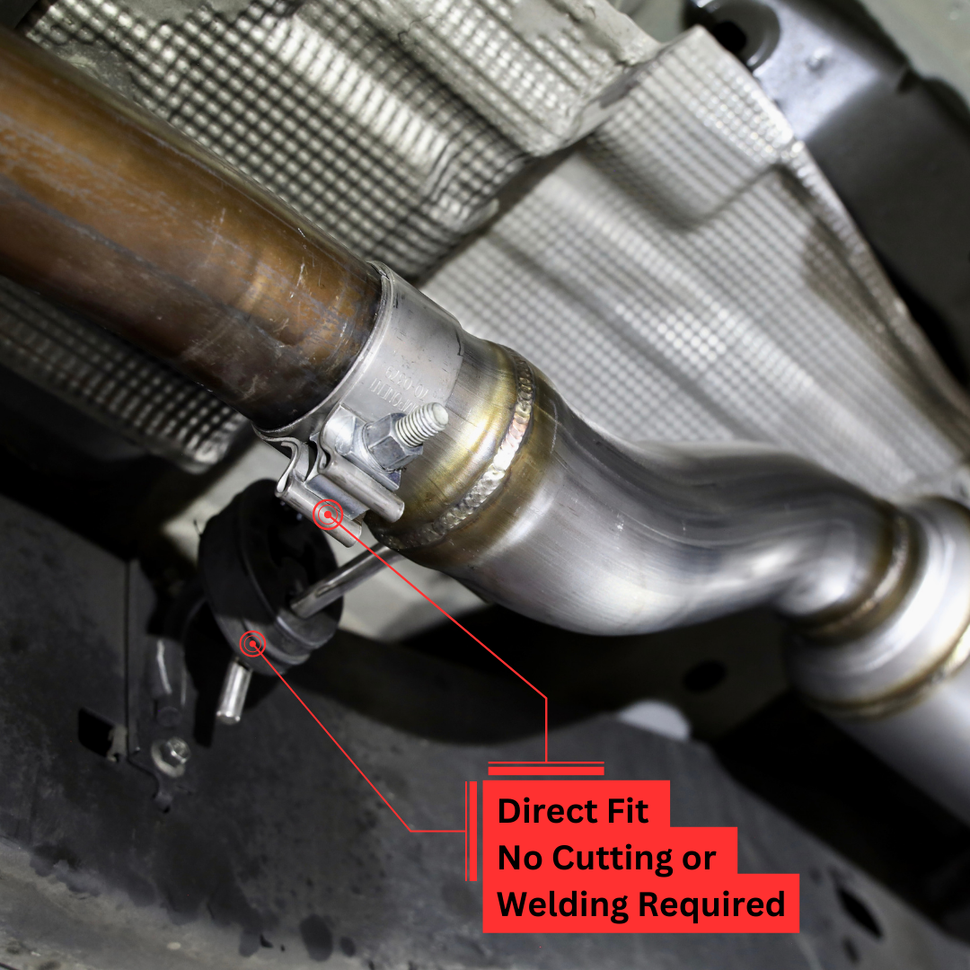 A close up of the connections of an installed 2019-2023 Ford Ranger Over Axle Carven Exhaust Dump Kit on the underside of a vehicle with text that says "Direct Fit. No Cutting or Welding Required"