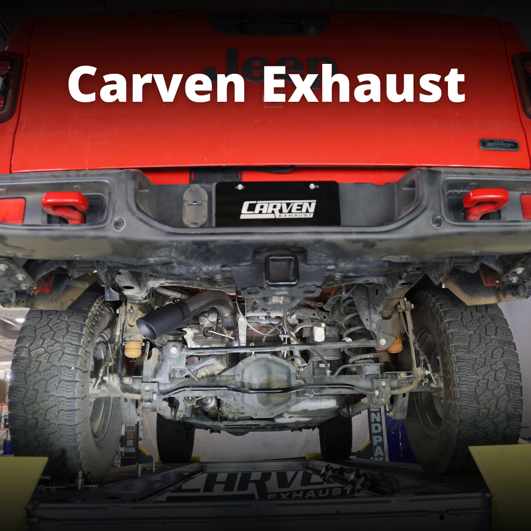 The back of a red jeep with an installed 2020-2025 Jeep Gladiator Carven Exhaust Over Axle Dump Exit Exhaust System with text that says "Carven Exhaust"