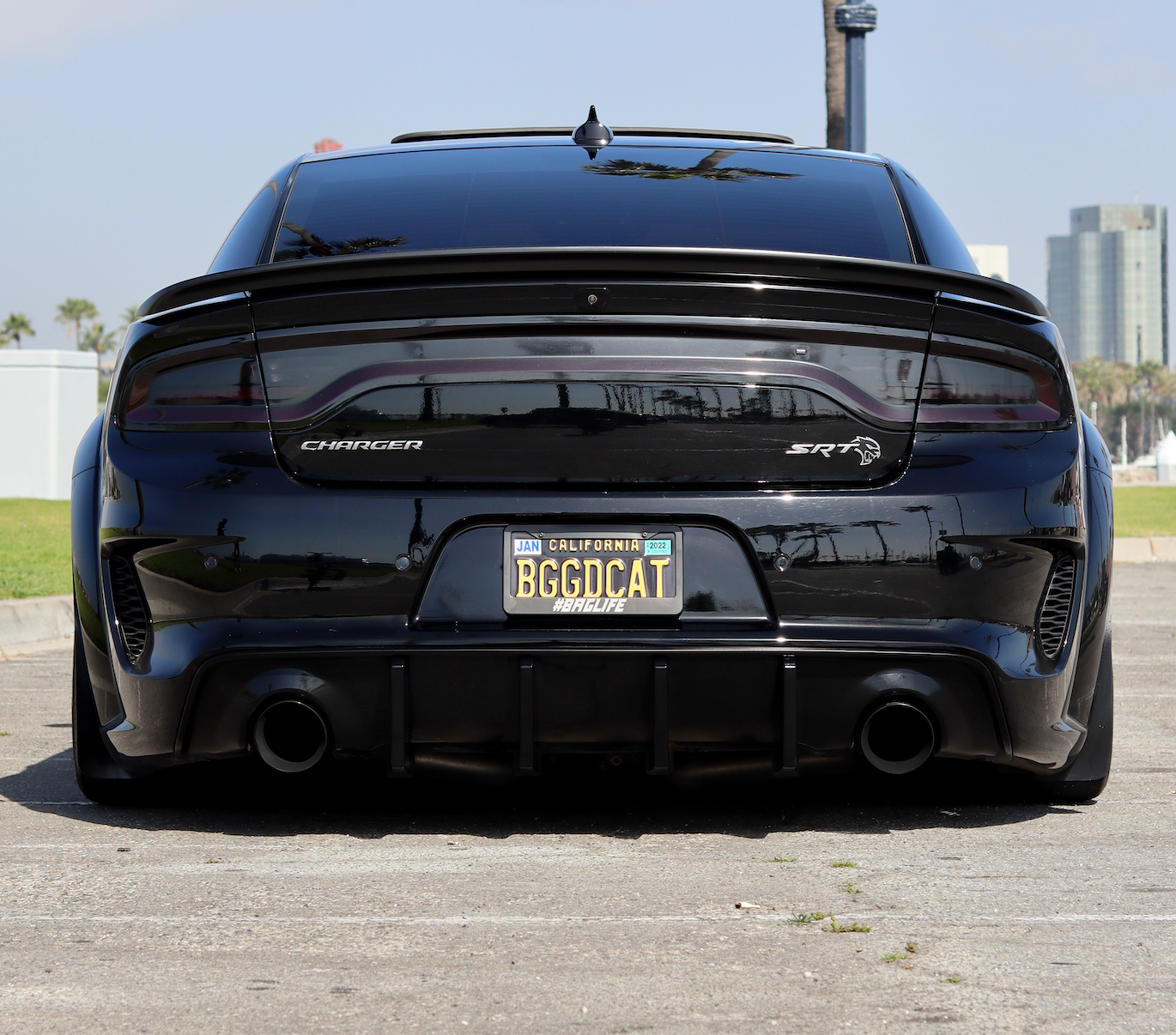 The backside of a Dodge Charger with an installed 2015-2023 Dodge Charger Carven Exhaust 5.0" Tip Replacement Set