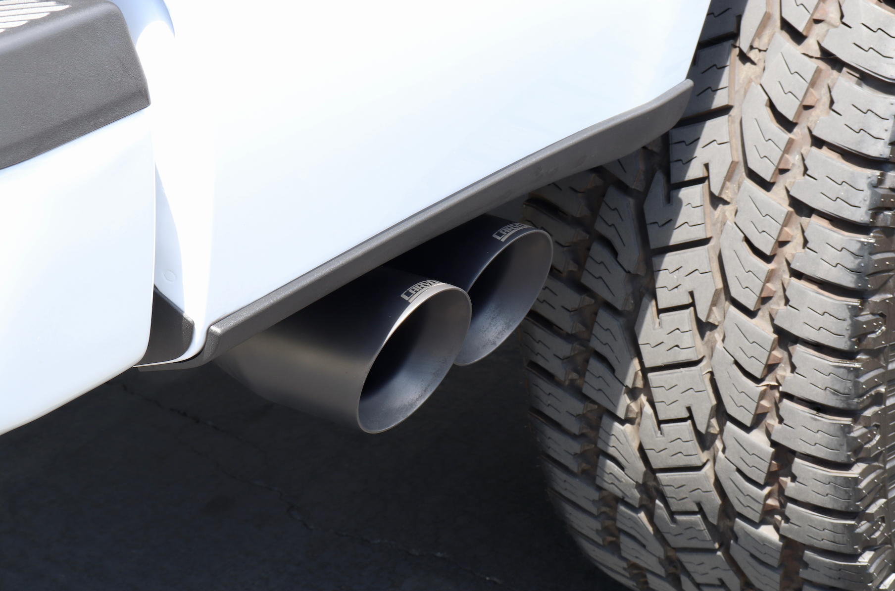 A close up of installed Dual Exit Tips in the Cerakote black color