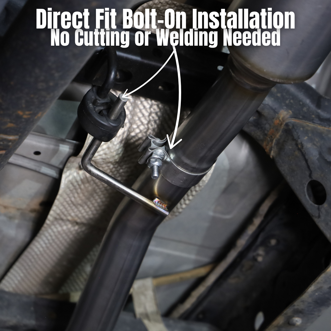 An installed 2005-2015 Toyota Tacoma 4.0L Short Bed Carven Exhaust Dump Exit Exhaust Kit showing direct fit bolt-on installation and no cutting or welding needed