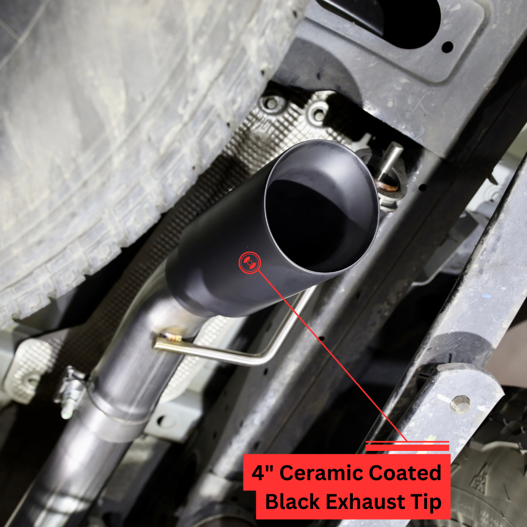 A close up of a black exhaust tip installed on the underside of a vehicle with text that says "4 inch Ceramic Coated Black Exhaust Tip"
