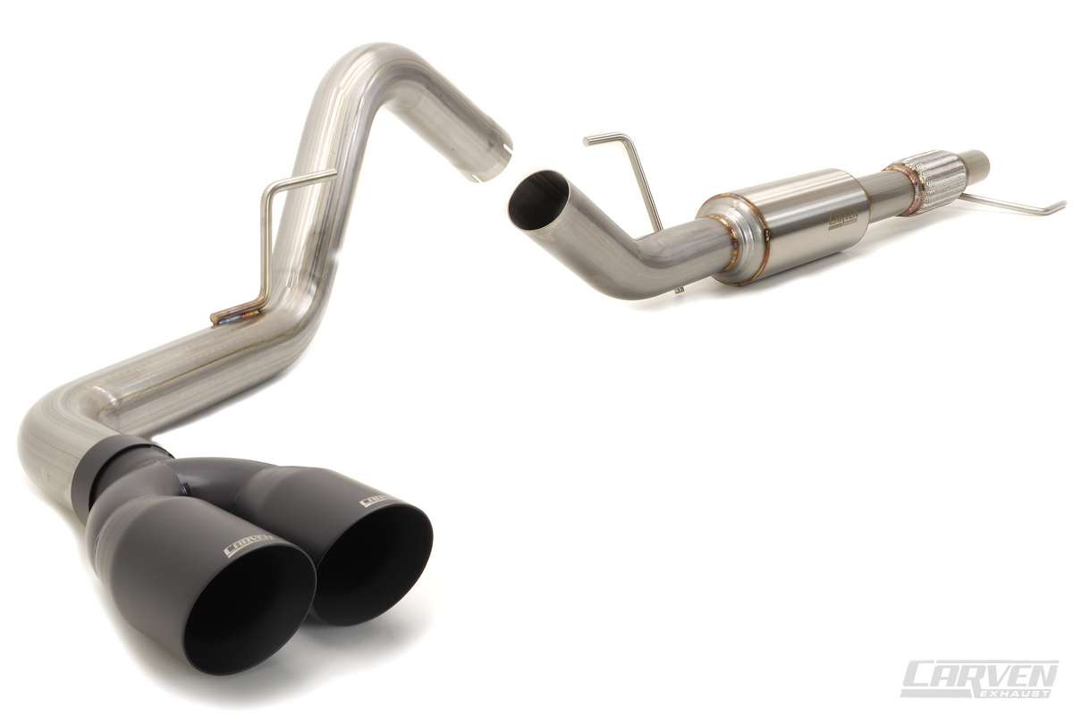 A product photo of a 2015-2020 Ford F-150 EcoBoost Carven Exhaust Cat-Back Kit with 4” Dual Exit Tips in the Cerakote black color