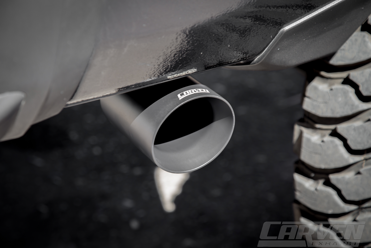 Close up of a cerakote black 4.0” Single Exit Tip installed on a truck