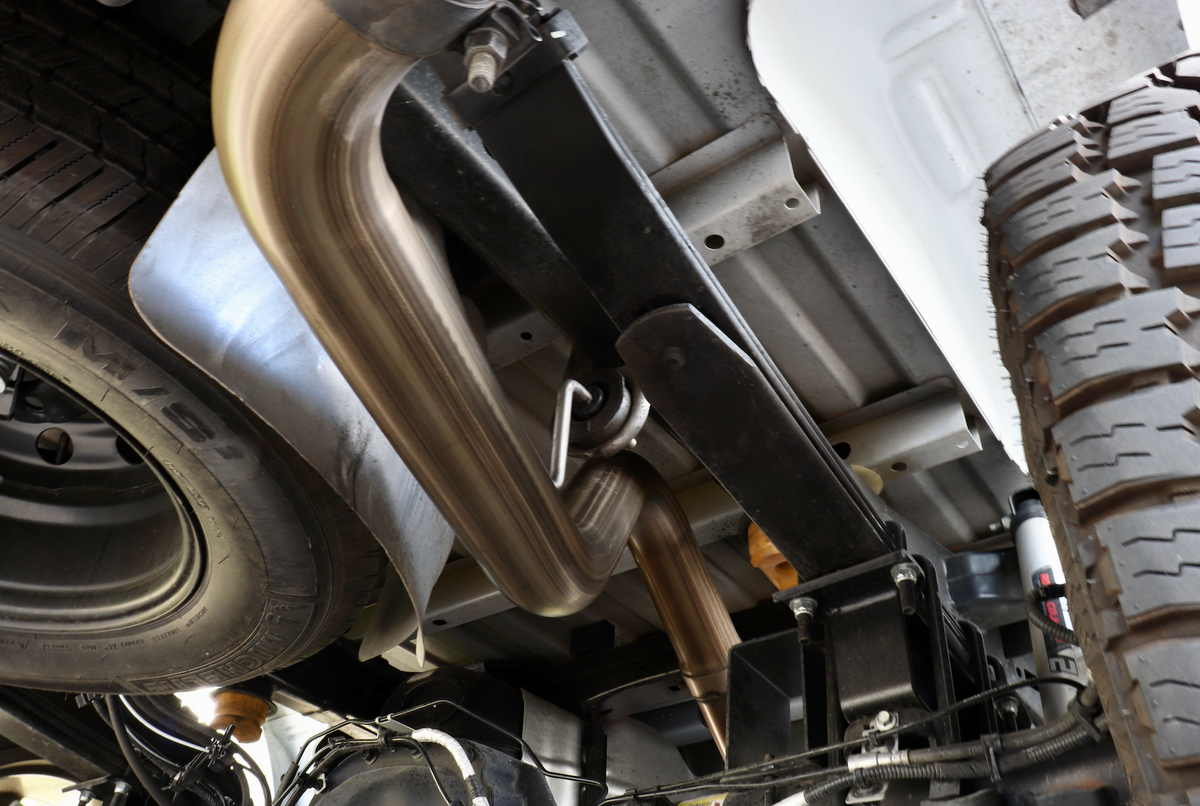 The underside of a truck with an installed 2015-2020 Ford F-150 Eco-Boost Cat-Back Kit