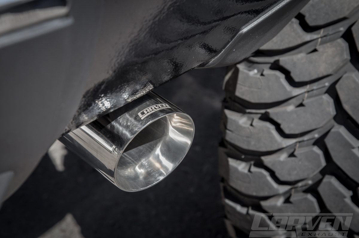 Close up photo of a polished stainless 4.0” Single Exit Tip installed on a truck